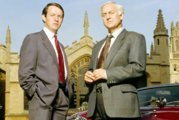 Inspector Morse and Sergeant Lewis beside Oxford college and Morse's car.