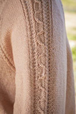 Close up of cardigan sleeve knitted pattern