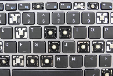 Top down view of a computer keyboard with lots of missing keys