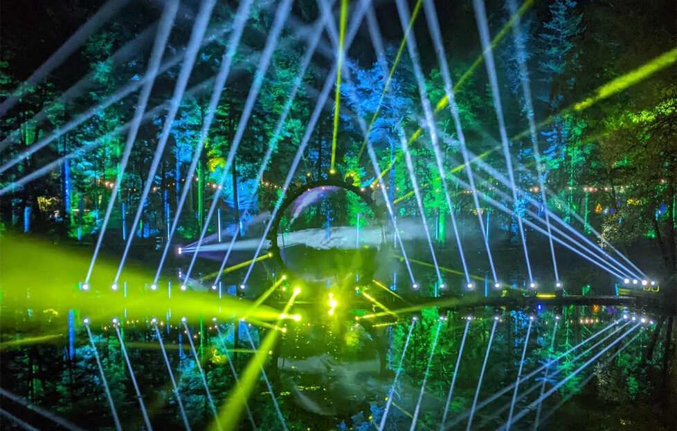 Enchanted Forest, Pitlochry, light show over lake of circle with blue and yellow light beams