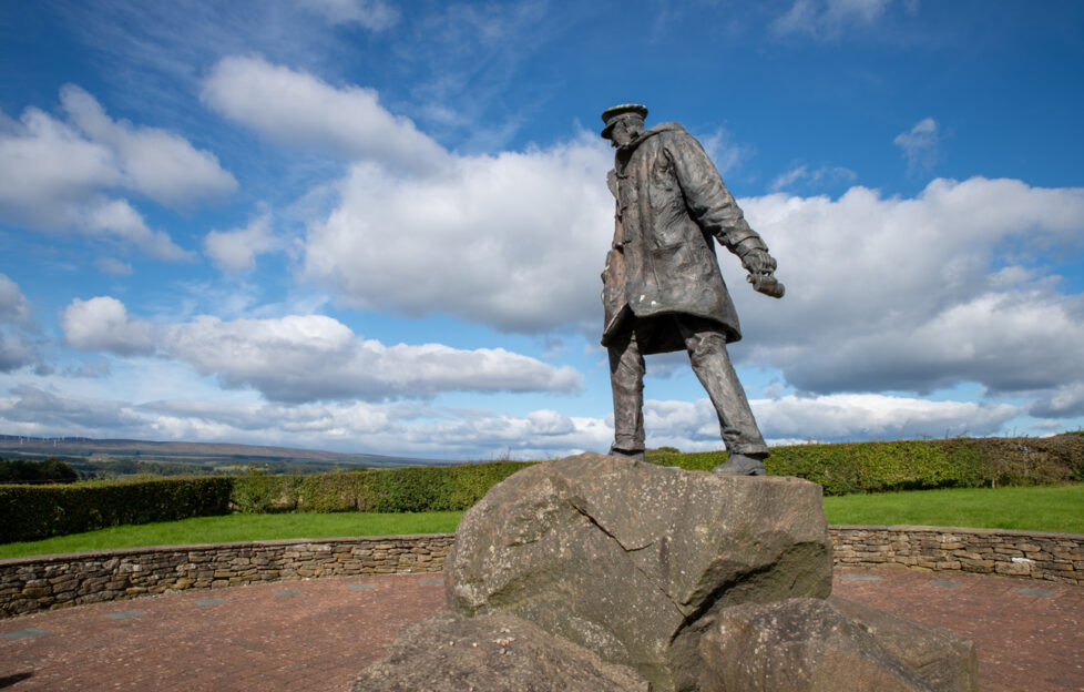 Statue of Sir David Stirling overlooking landscape and blue skies