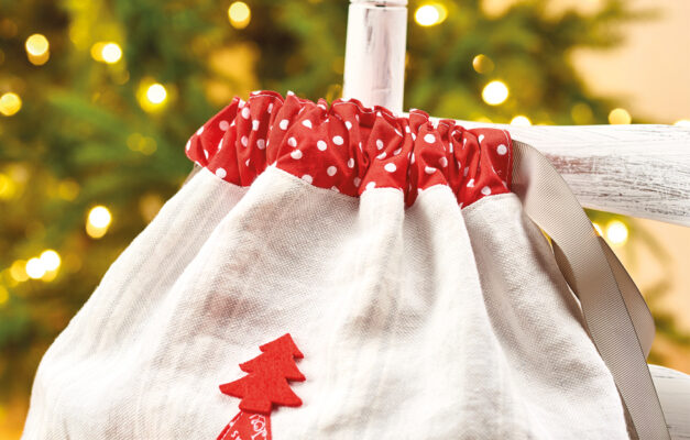 Close up of Christmas present sack drawstring bag with string tied