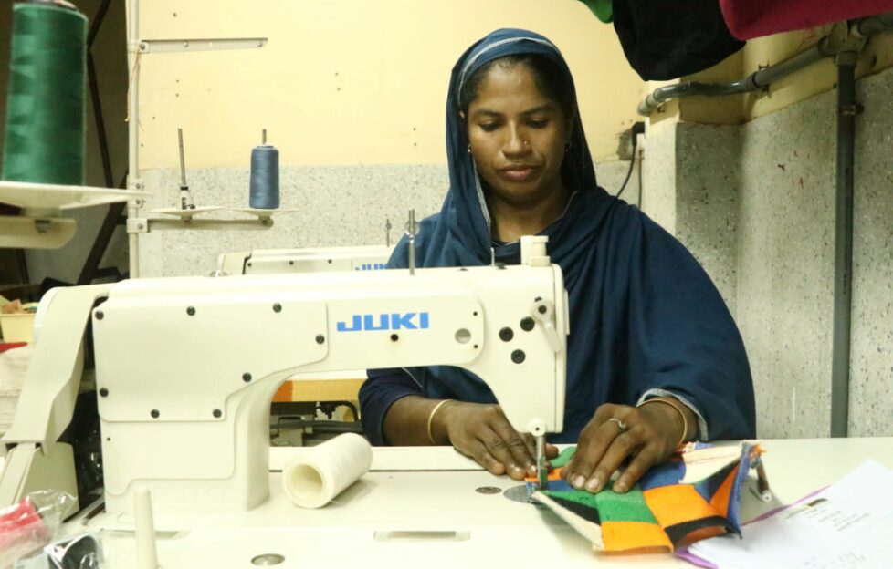 Shilpi using a sewing machine