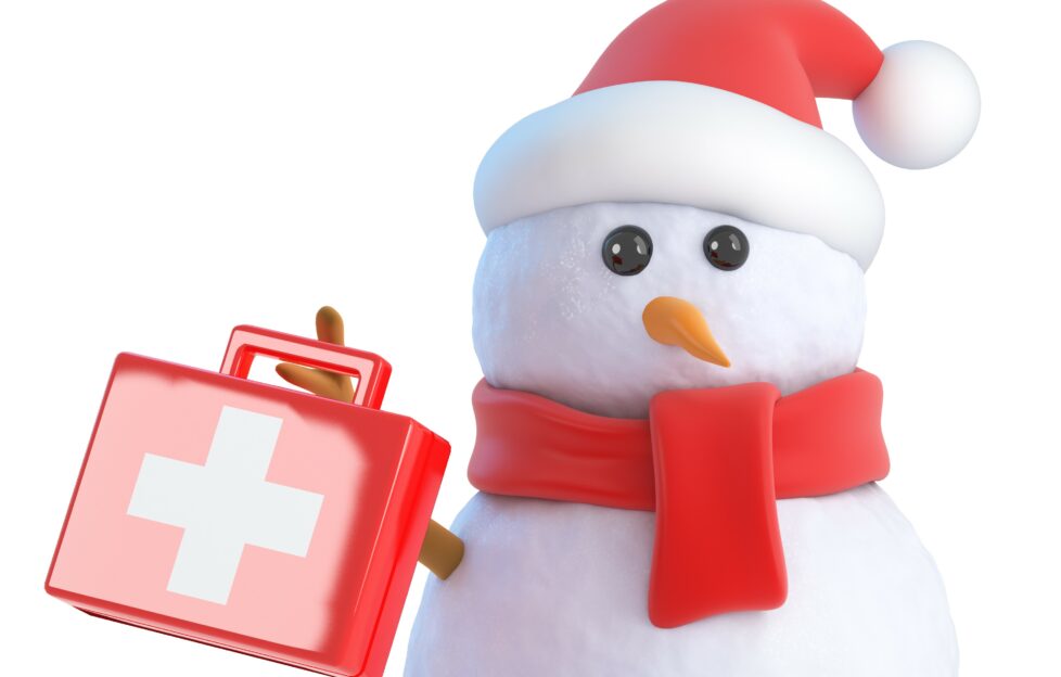 Snowman holding first aid box