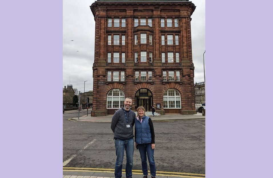 Alex and Maddie Grigg standing in front of the Meadowside DC Thomson building in Dundee
