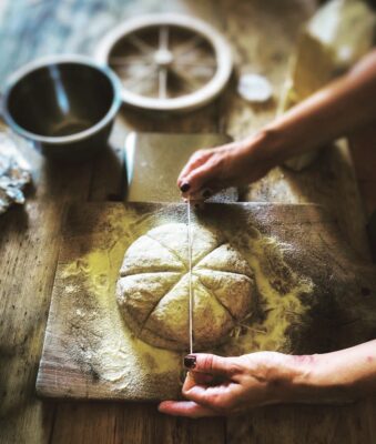 Forming panis quadratus bread.