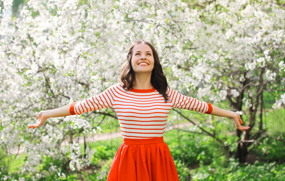 A woman in a spring garden, an illustration for our latest writing prompt story starter on spring themes