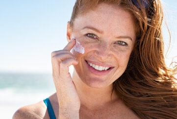 Lady applying sun cream Pic: Shutterstock