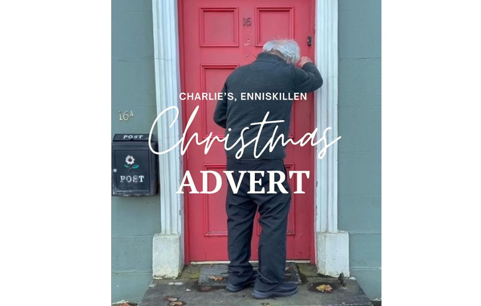 The opening scene from the Charlie's Bar Budget Christmas ad. An elderly man is seen leaving his home with a bunch of flowers. 'Charlie's Enniskillen Christmas Advert'