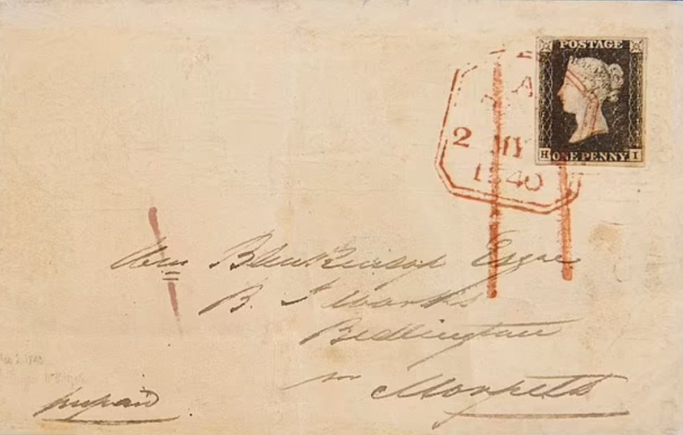 First ever envelope sent with Penny Black stamp worth 2 million. Image features the outside of the envelop with address scrawled on it. The Penny Black stamp sits in top righthand corner and there's an ink stamp dating it May 2, 1840.