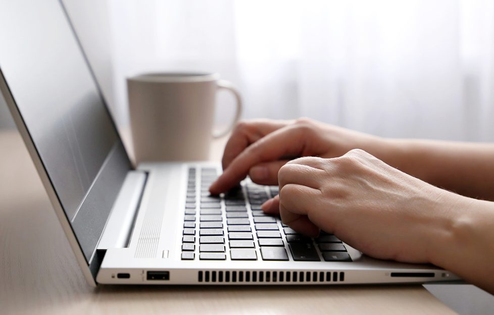 Hands typing on a laptop Pic: Shutterstock