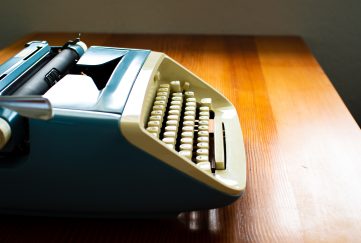 Side view of traditional typewriter.