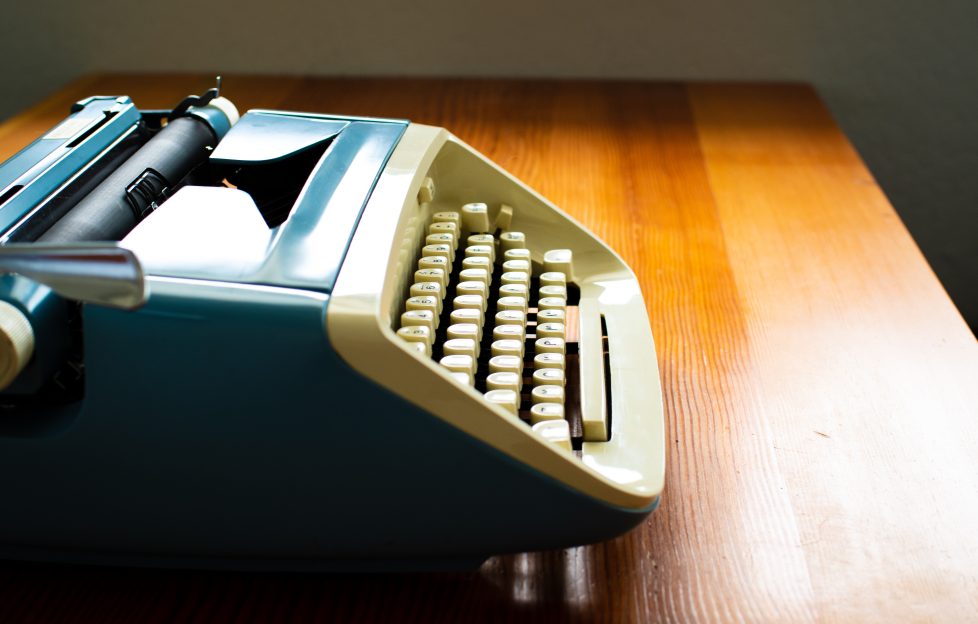 Side view of traditional typewriter.