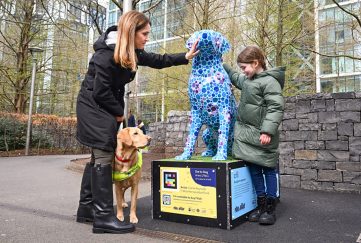 Lorriane Offord, daughter Lily, aged 7, and guide dog Theia, visiting one of the sculptures from ‘Paws on the Wharf ‘. Credit: Matt Crossick/PA wire.