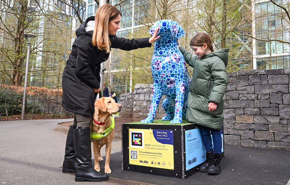 Lorriane Offord, daughter Lily, aged 7, and guide dog Theia, visiting one of the sculptures from ‘Paws on the Wharf ‘. Credit: Matt Crossick/PA wire.