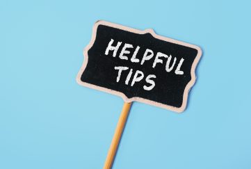 Sign saying 'Helpful Tips' on a light blue background.