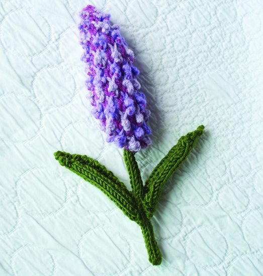 Close up of knitted lilac flower