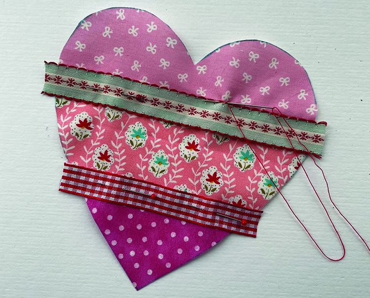 Braid going across the heart shaped fabric