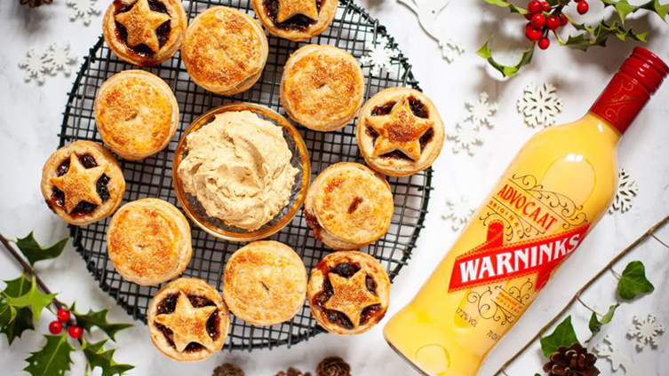 Brandy butter on a platter with mince pies