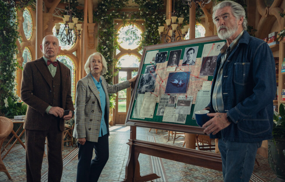 Actors Helen Mirren, Piers Brosnan and Ben Kingsley stand in character in front of an investigation pin board for new film 'The Thursday Murder Club'