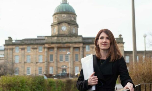 Kirsty Watson, a Keep Mum campaigner, standing in front of Dr Gray's in Elgin.