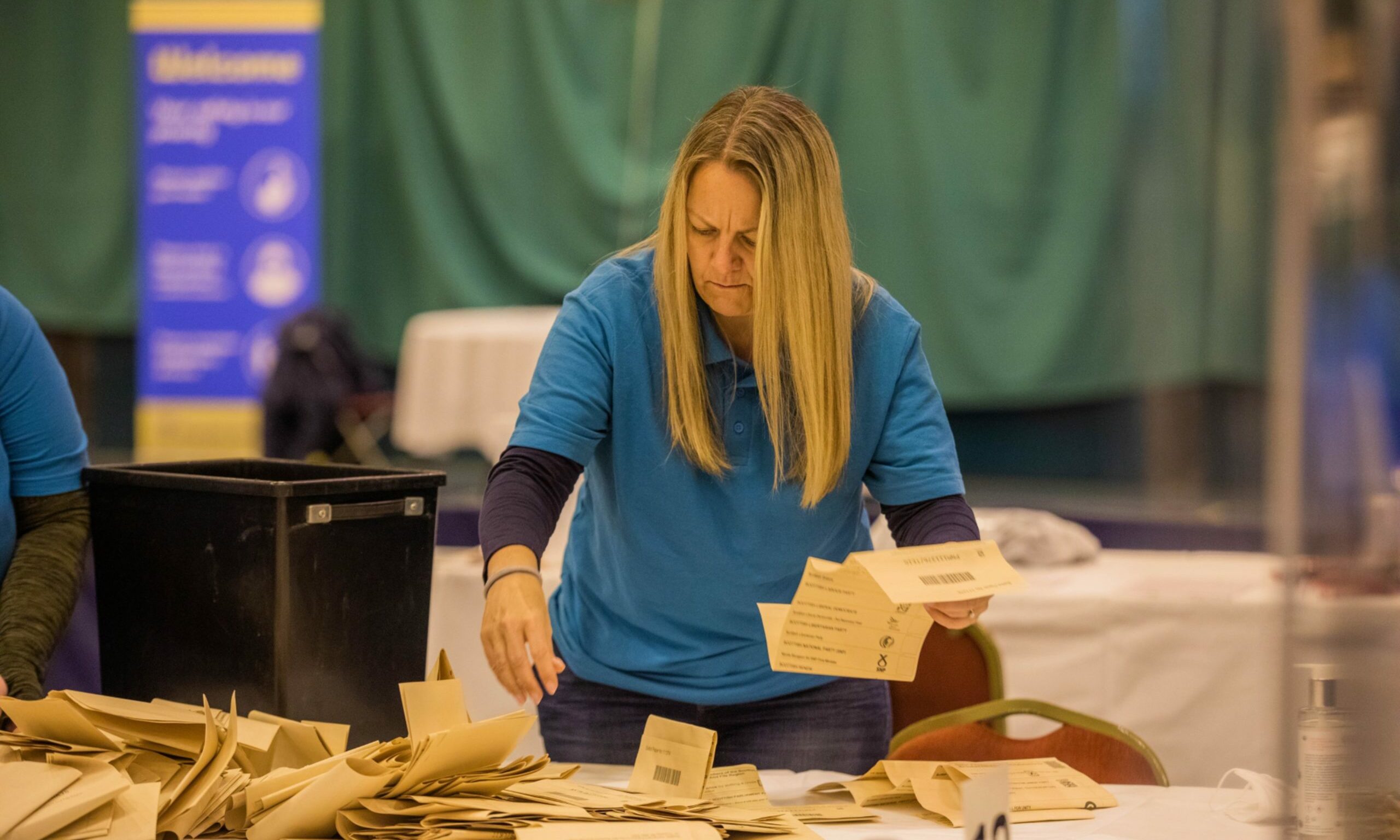 A woman counting the votes of the Scottish local elections