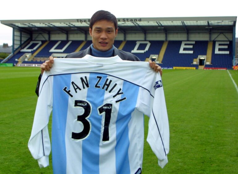 Chinese star Fan Zhiyi shows his new colours after signing for Dundee.