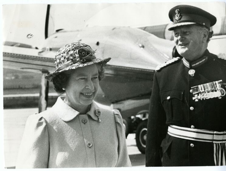 Her Majesty is greeted by Sir John Gilmour on her arrival at RAF Leuchars