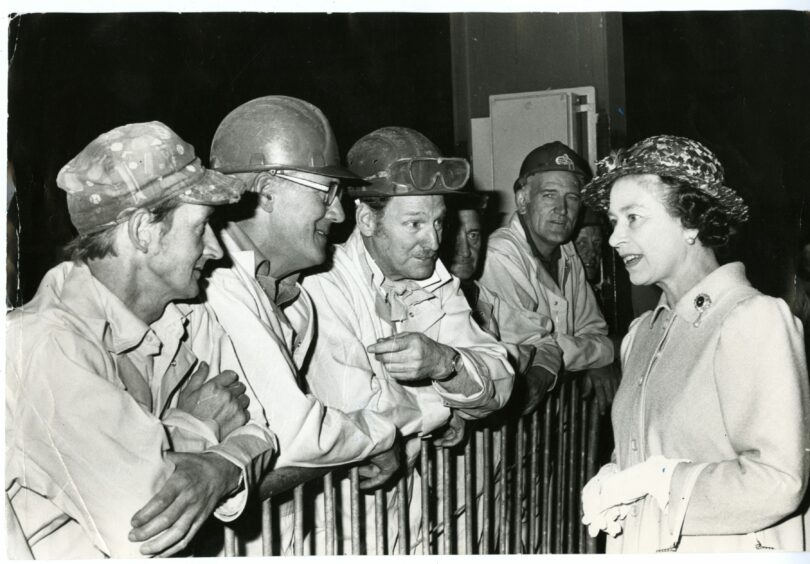 The Queen chats with workers during her visit to Methil.