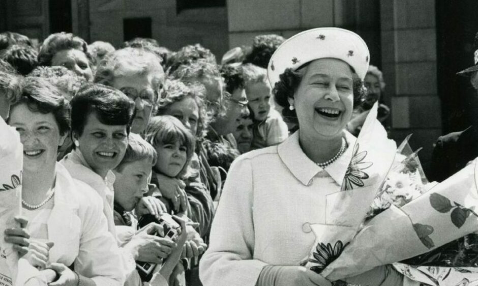 The Queen meets locals during her walk about in City Square. 