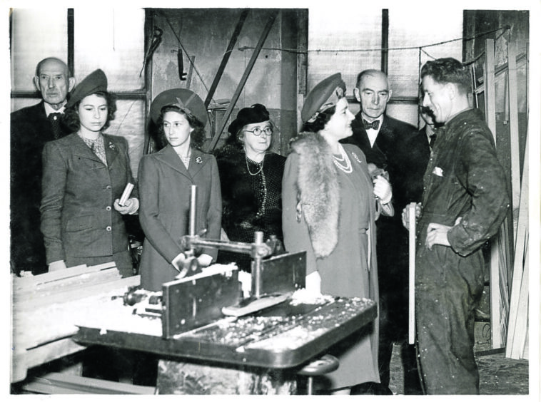 Queen Elizabeth and the young Princesses Elizabeth and Margaret visiting Lord Roberts' Memorial Workshops. 
