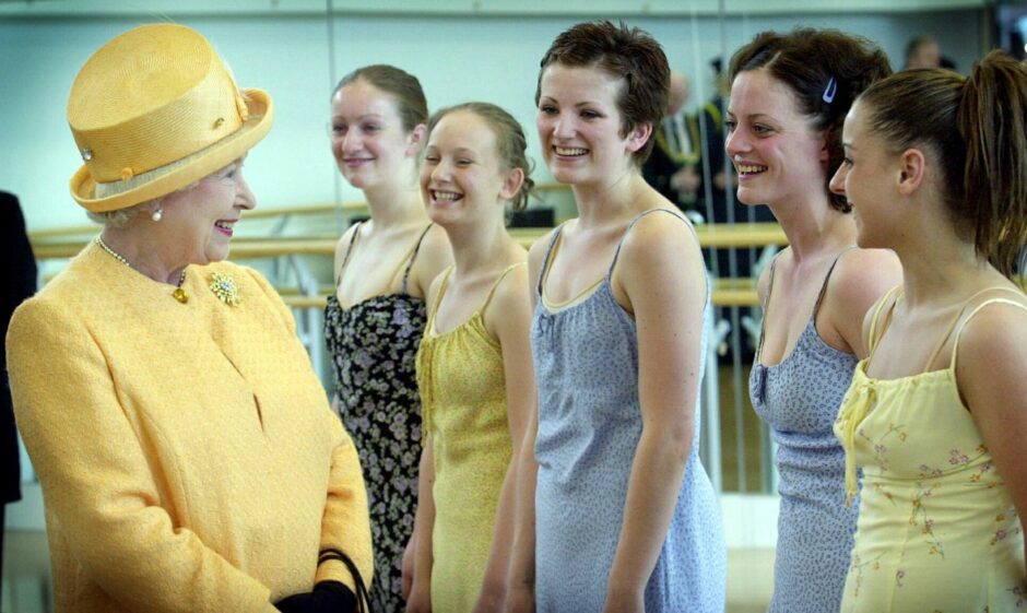 The Queen meets a dance group at 'The Space' in The Scottish School Of Contemporary Dance, part of Dundee College, during her Golden Jubilee tour 