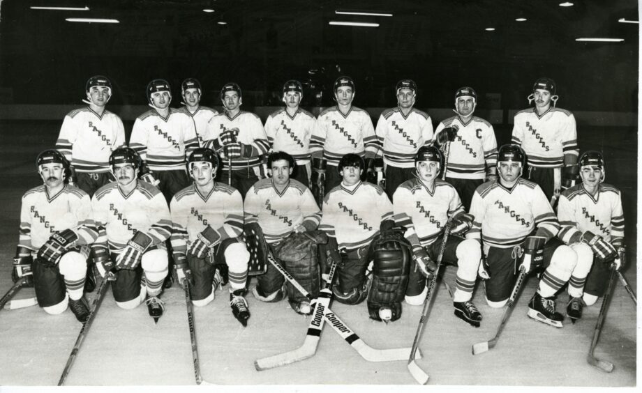 The Dundee Rockets line up for the 1983-84 season, with the players lined up on the rink in full gear