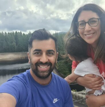 Scotland's first minister Humza Yousaf with his wife Nadia El-Nakla and child in Dundee.