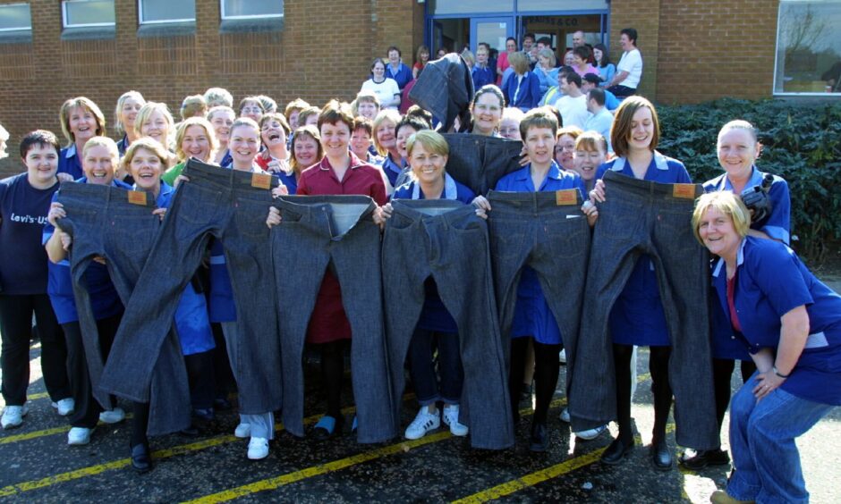 Staff with some of the last jeans made at the Levi's factory before closure. Image: DC Thomson.