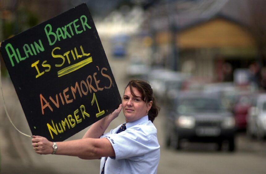 Aviemore hotel worker Caroline Murray shows the village's continuing support for Alain Baxter in 2002.