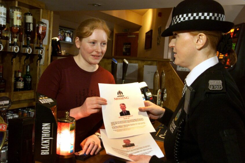 Police put up missing person posters across Forfar following the disappearance of Mr Murray.
