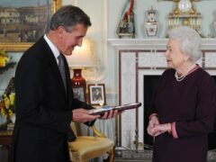 The Queen presents the Order of Merit to Neil MacGregor (Stefan Rousseau/PA)