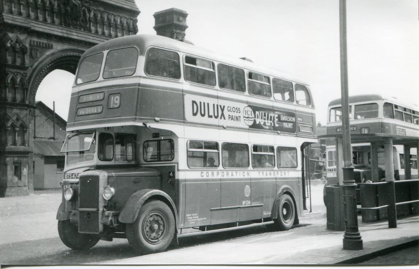 A bus waiting next to the Royal Arch, which was demolished in the 1960s.