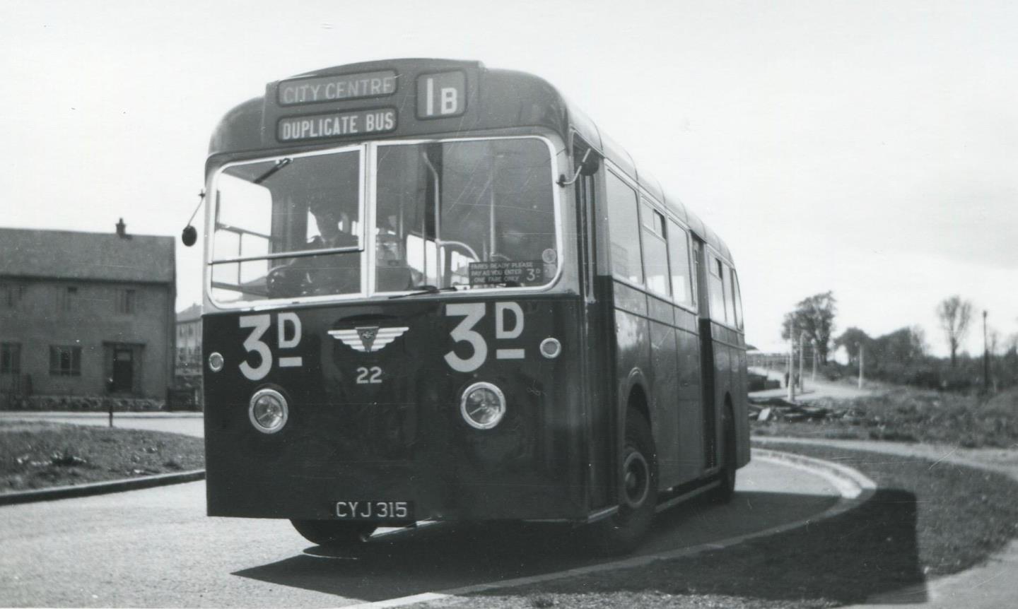 A bus in 1954 waiting at the large roundabout at the end of Macalpine Road and its junction with Laird Street.