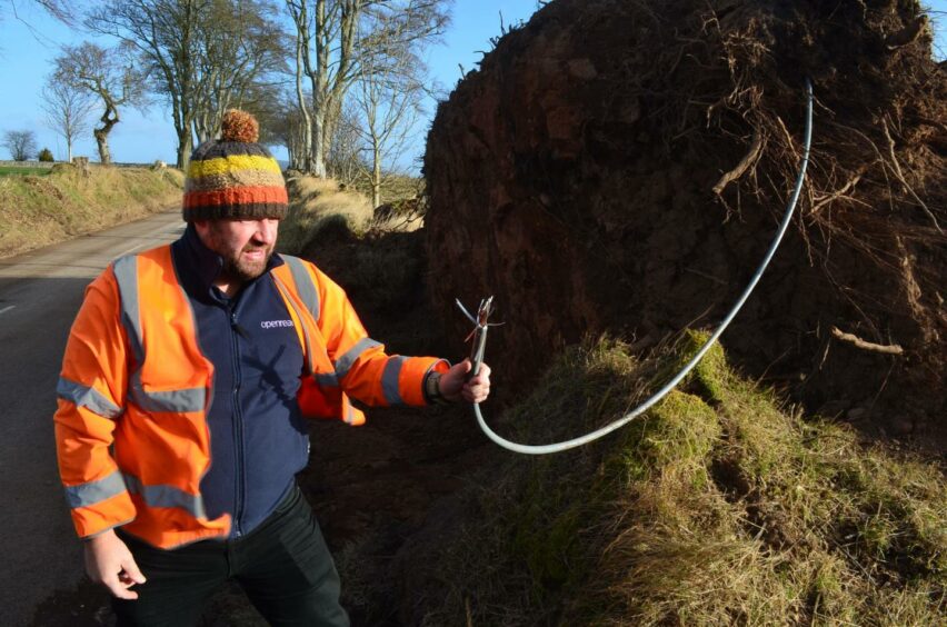 Engineer Gary Taylor with a damaged cable near Edzell. 