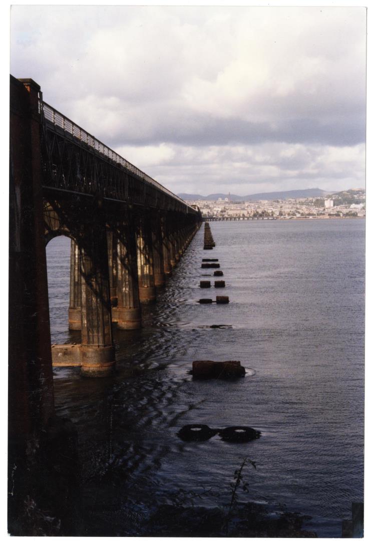 The supports of the original rail bridge can still be seen in the Tay.