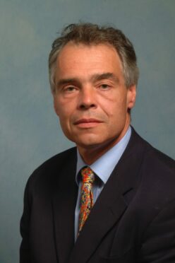 Supplied by Aberdeen University James McLay is shown in a shirt and tie in a formal pose.