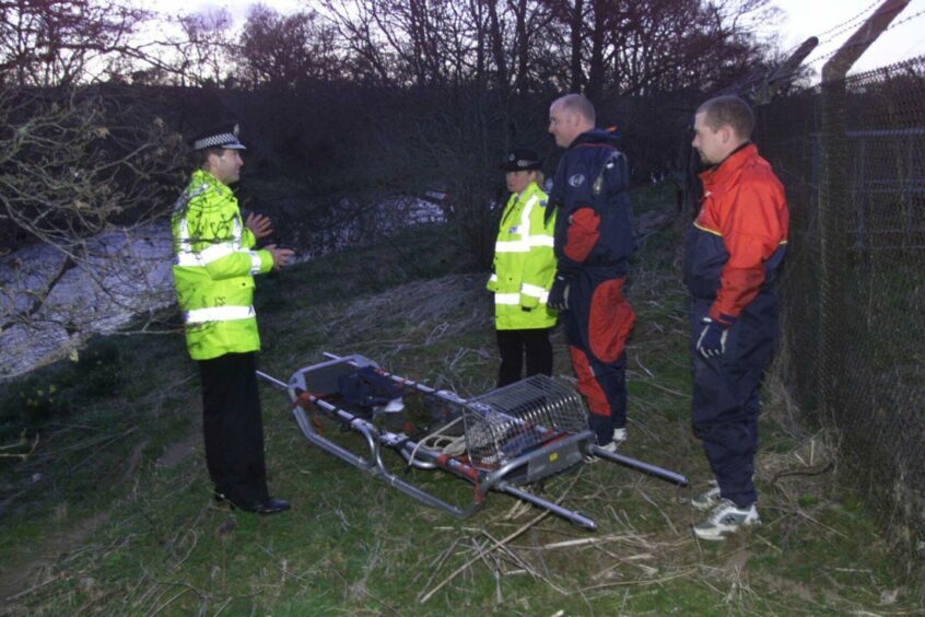 Police at the scene after the body was recovered from the water.