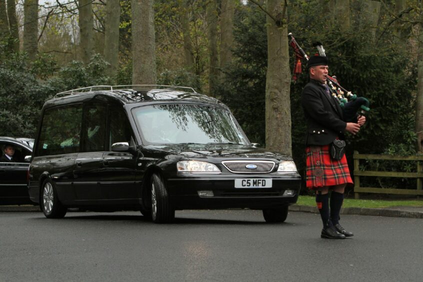 The hearse is piped into Kirkcaldy Crematorium for Jocky's final journey.