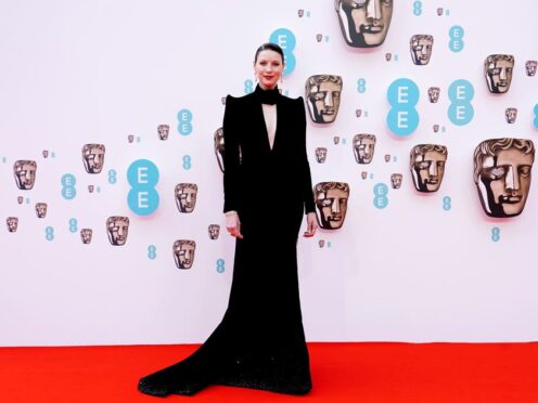 Caitriona Balfe wore a black velvet dress with slicked-back hair and pearl drop earrings (Ian West/PA)