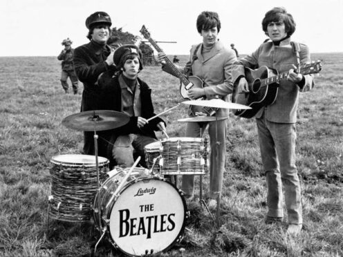 The Beatles John Lennon, Ringo Starr, Paul McCartney and George Harrison on Salisbury Plain during the filming of Help (PA)