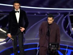 Aneil Karia, left, and Riz Ahmed accept the award for best live action short for The Long Goodbye at the Oscars (Chris Pizzello/AP)