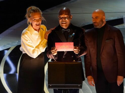 Uma Thurman, Samuel L Jackson and John Travolta reunited to present the award for best actor at the Oscars (Chris Pizzello/AP)