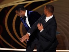 Will Smith hits presenter Chris Rock on stage at the Oscars (Chris Pizzello/AP)